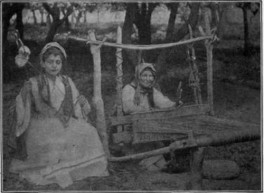 primitive-loom-and-a-girl-spinning-wool